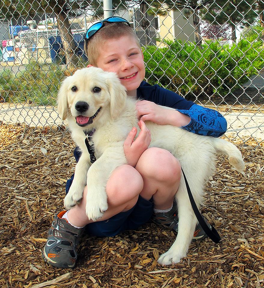 kid with puppy